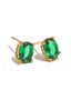 close up of sophia classic oval cut cubic zirconia earrings gold plated setting on white backdrop